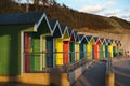 Closeup of Colorful huts along the seafront basking in the golden sunset