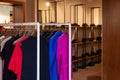 Closeup colorful male, female clothes in boutique hanging on hangers, clothing rack on metal stand. Concept opening Royalty Free Stock Photo