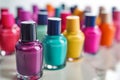 closeup of colorful nail polish bottles on white manicure table Royalty Free Stock Photo