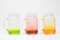 Closeup of colorful paints in three mason jars isolated on a white background Royalty Free Stock Photo