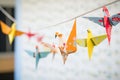 closeup of colorful paper origami birds on string Royalty Free Stock Photo