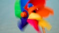 Closeup of colorful pinwheel twirls gracefully in the wind, reminding viewers of the joys of travel, summer holidays, and vacation Royalty Free Stock Photo