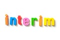 colorful plastic letters on white background - Interim