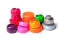 colorful plastic plugs for recycling on white background