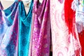 Closeup of colorful Portuguese fabrics and shawls in turquoise, pink and purple colors