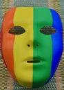 A closeup of a rainbow mask on the table Royalty Free Stock Photo