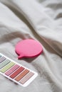 Closeup of colorful stickers on a white bedsheet