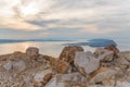 Closeup of colorful stones by sunset at cliffs on croatias mediterranean coast