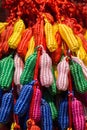 Closeup of colorful weaved peanut-shaped yarn ornaments