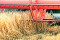 Closeup Combine harvesting a wheat field. Combine working