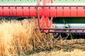 Closeup Combine harvesting a wheat field. Combine working Royalty Free Stock Photo