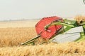 Closeup Combine harvesting a wheat field. Combine working the field Royalty Free Stock Photo