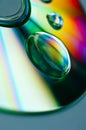 Closeup of compact disk with big water droplets Royalty Free Stock Photo