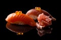 Closeup composition of two fresh salmon sashimi sushi with caviar Royalty Free Stock Photo