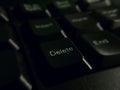 Closeup of computer laptop keyboard selective focus on delet key Royalty Free Stock Photo