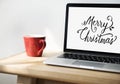 Closeup of computer laptop with Merry Christmas words Royalty Free Stock Photo