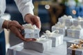 closeup of concierges hands arranging welcome gifts