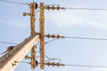 Closeup of concrete electric pylon energy and technology electrical on the road with power line cables Royalty Free Stock Photo