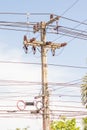 Closeup of concrete electric pylon energy and technology electrical on the road with power line cables Royalty Free Stock Photo