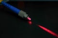 Closeup of connectors of optical fiber network cable. The laser shines from the optical cable Royalty Free Stock Photo