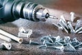 Closeup construction building tools, electric screwdriver and screws. Royalty Free Stock Photo