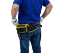 Construction man workers in blue shirt with Protective gloves, helmet with tool belt hand holding hammer isolated on white Royalty Free Stock Photo