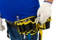 Construction man workers in blue shirt with Protective gloves, helmet with tool belt hand holding hammer isolated on white Royalty Free Stock Photo