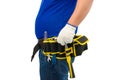 Construction man workers in blue shirt with Protective gloves, helmet with tool belt hand holding hammer isolated on white Royalty Free Stock Photo