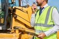 Construction Foreman Giving Instructions by Radio Royalty Free Stock Photo