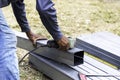 Closeup of construction workers' hands cutting steel Royalty Free Stock Photo