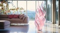 A Closeup of a Contemporary Rose Pink Glass Sculpture Showcased in Front of a Stunning, Modern Living Room