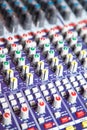 Closeup of the controls on an audio mixing console. Royalty Free Stock Photo