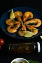 Closeup of cooked shrimps served on blue plate