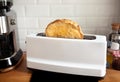 Closeup cooking bread with toaster on counter bar kitchen in morning