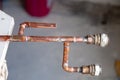 Closeup copper old pipes. Concept installation new plumbing, changing plumbing, repair of the pipeline, professional master Royalty Free Stock Photo