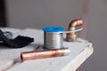 Closeup copper pipes, fittings, aluminum flux paste for solder for brazing with gas burner. Concept installation, repair, change Royalty Free Stock Photo