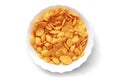 Corn flakes in a white bowl isolated on white background, top view Royalty Free Stock Photo