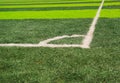 Closeup corner of artificial green grass football surface, beautiful sunny day