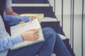 Closeup couple asian handsome man and beautiful woman reading book and glad at home Royalty Free Stock Photo