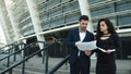 Closeup couple discussing documents near stadium. Couple discussing project Royalty Free Stock Photo