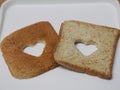 Couple Heart shaped on Whole Wheat Bread put on white tray, background love Valentine Day Royalty Free Stock Photo