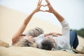 closeup couple making heart shape at beach Royalty Free Stock Photo