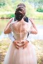 Closeup of couple making heart shape with hands. Wedding couple on the nature is hugging each other. Beautiful model girl in white Royalty Free Stock Photo