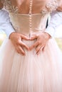 Closeup of couple making heart shape with hands. Wedding couple on the nature is hugging each other. Beautiful model girl in white Royalty Free Stock Photo