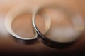 Closeup of couple silver wedding rings, two luxury golden engage