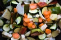 Closeup of courgettes, carrots, peppers, onion, aubergines and garlic cut ready to be cooked Royalty Free Stock Photo