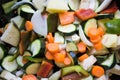 Closeup of courgettes, carrots, peppers, onion, aubergines and garlic cut ready to be cooked Royalty Free Stock Photo