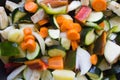 Closeup of courgettes, carrots, peppers, onion, aubergines and garlic cut ready to be cooked Royalty Free Stock Photo