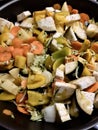 Closeup of courgettes, carrots, peppers, onion, aubergines and garlic cut ready to be cooked Royalty Free Stock Photo
