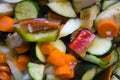 Closeup of courgettes, carrots, peppers, onion, aubergines and garlic cut ready to be cooked Royalty Free Stock Photo